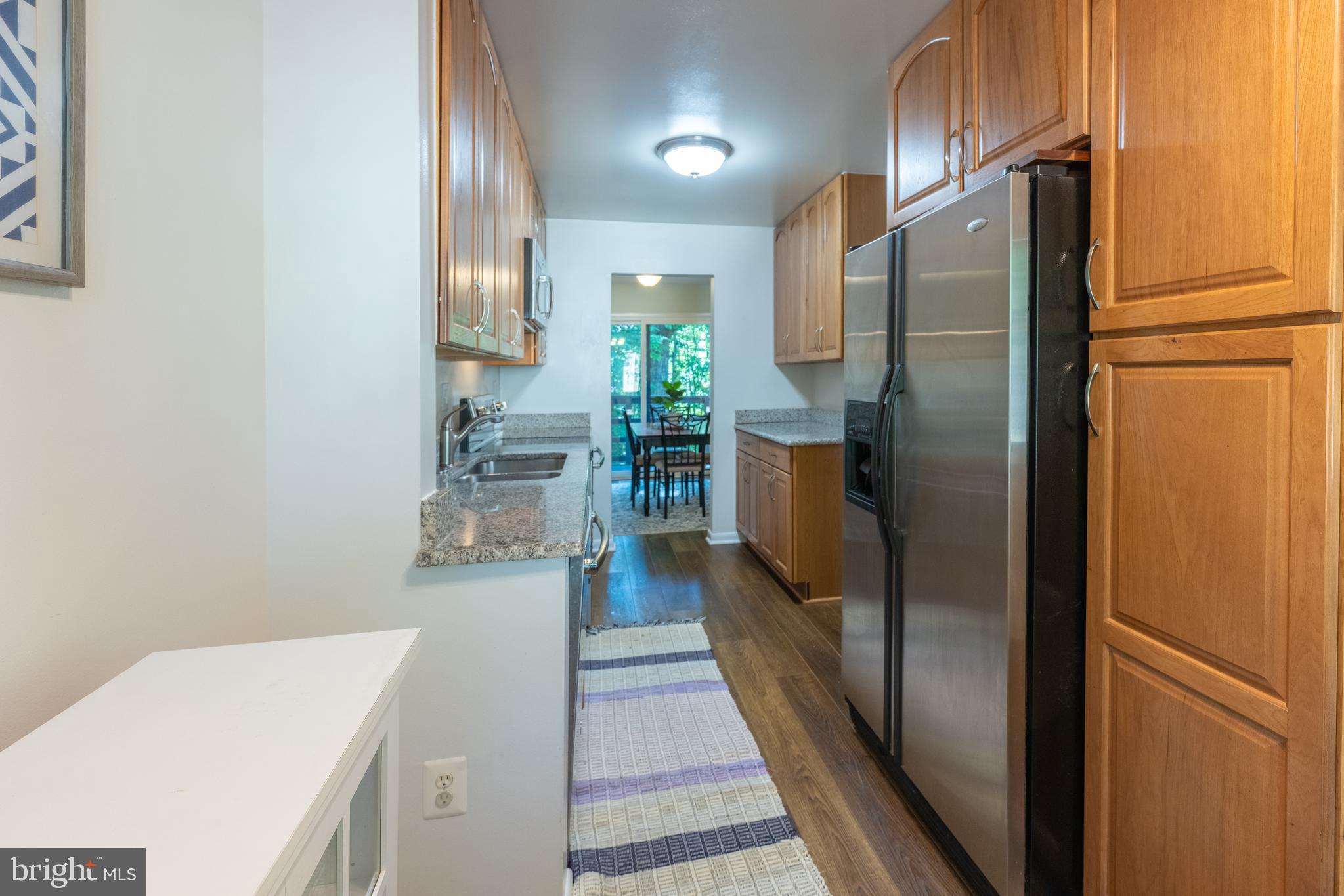 11917 Barrel Cooper Court Reston, VA 20191 - Photo 6 of 59 a kitchen with a refrigerator and countertop
