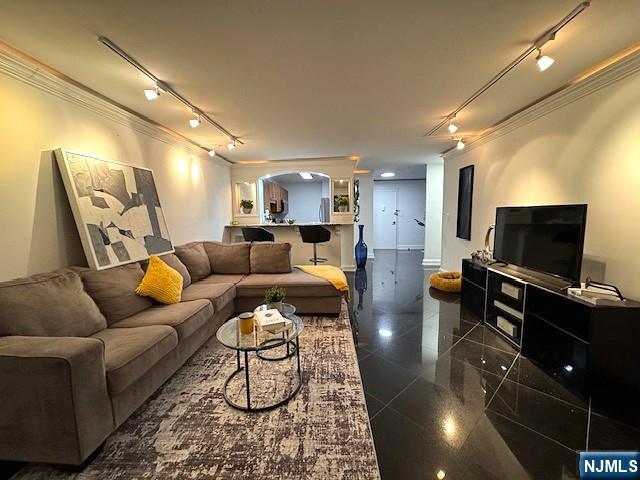 1203 River Road, Unit 19K Edgewater, NJ 07020 - Photo 3 of 19 a living room with furniture and a flat screen tv