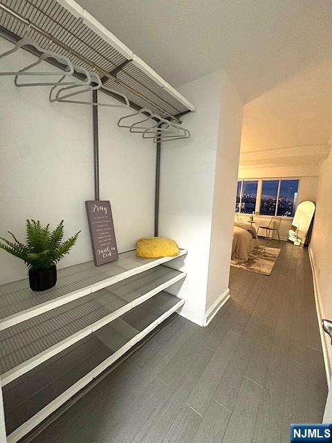 1203 River Road, Unit 19K Edgewater, NJ 07020 - Photo 7 of 19 a room with gym equipment and a table