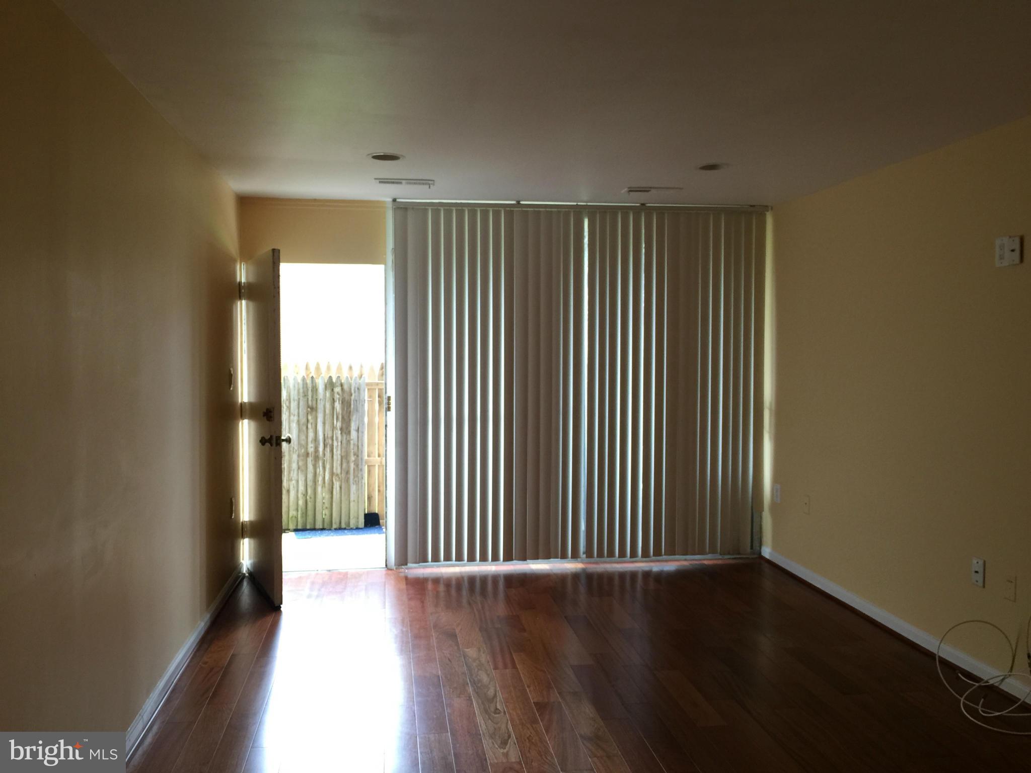 3942 Bel Pre Road, Unit 1 Silver Spring, MD 20906 - Photo 3 of 20 Living Room - walkout to patio and backyard