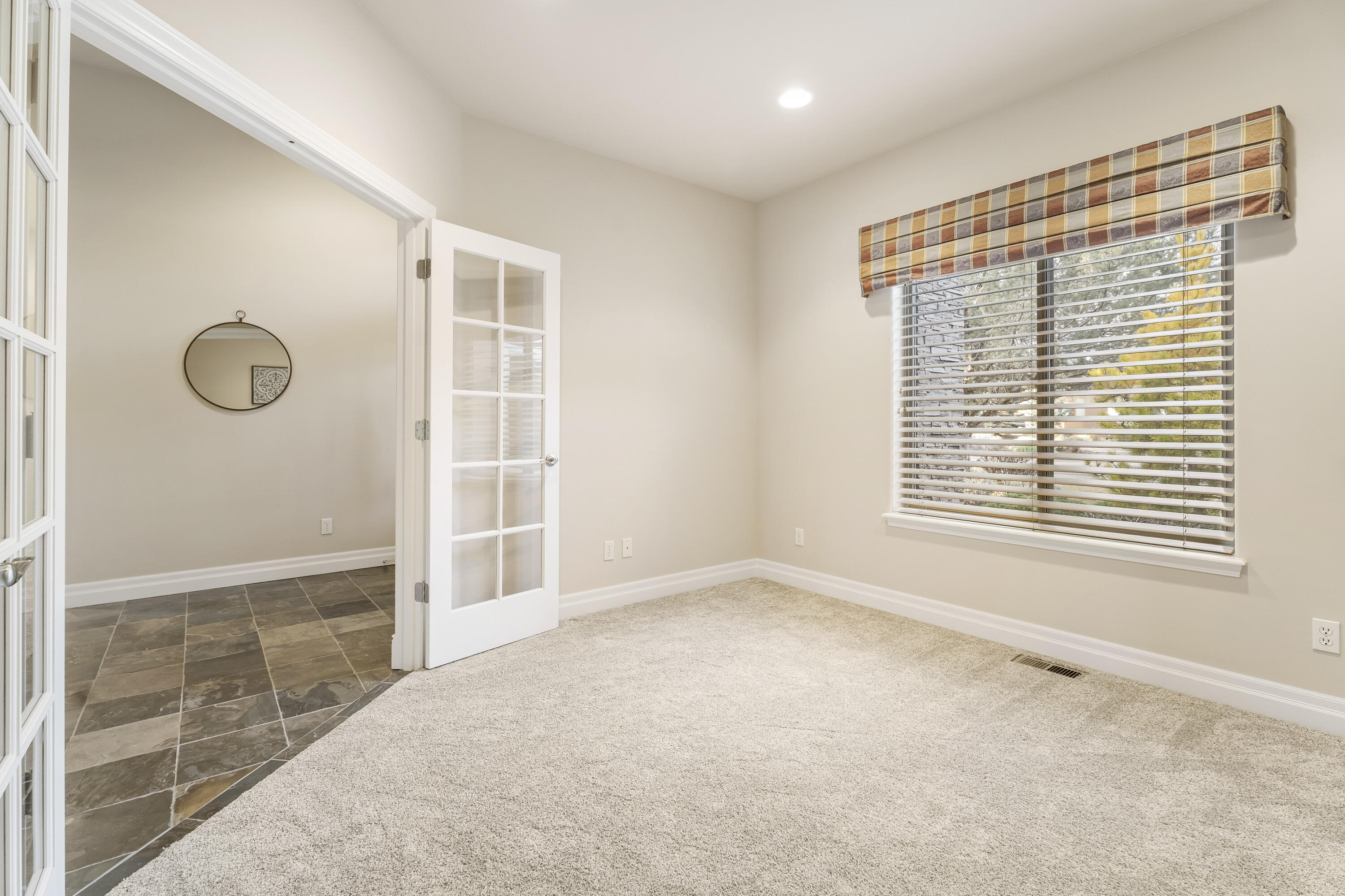784 Ribbon Falls Road Redmond, OR 97756 - Photo 12 of 79 a view of an empty room with a window