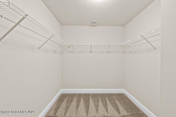 1336 Rabbit Street Southeast Palm Bay, FL 32909 - Photo 7 of 16 a view of a room with racks on the wall