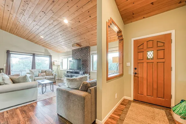 a large kitchen with stainless steel appliances granite countertop a stove sink and cabinets