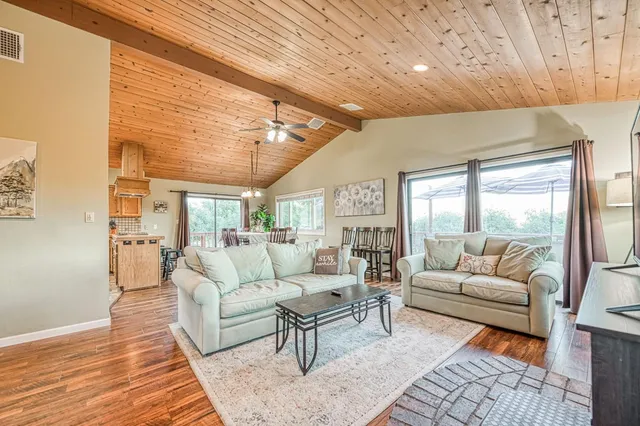 a bathroom with a granite countertop sink and a large mirror