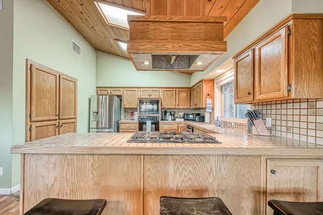 an aerial view of a house with mountain view