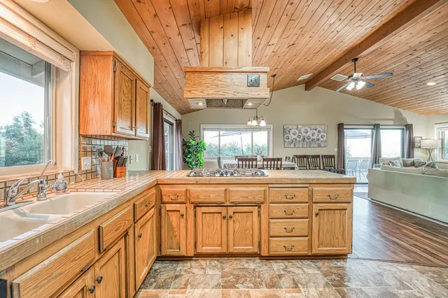 a front view of a house with a yard and a garage