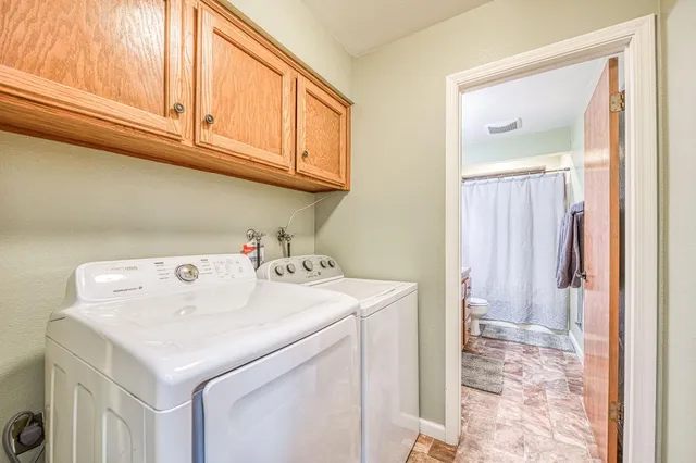a view of a house with a yard and roof