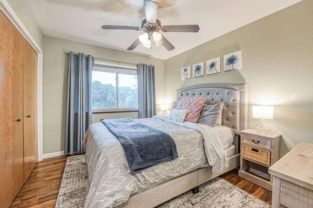 a kitchen with stainless steel appliances granite countertop a table chairs sink and cabinets