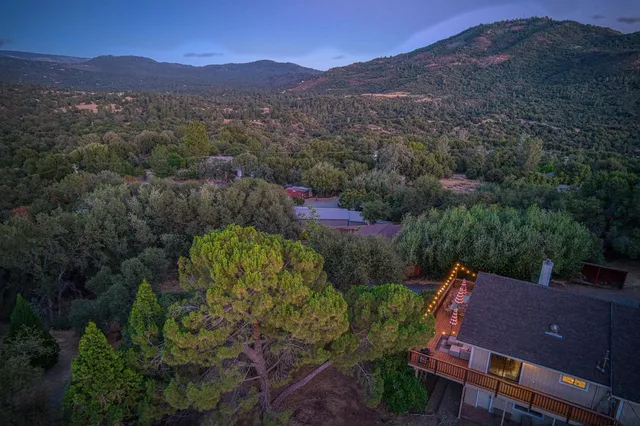 a view of a large mountain with mountains in the background
