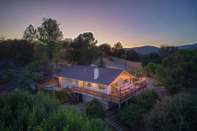a view of balcony with furniture and umbrella
