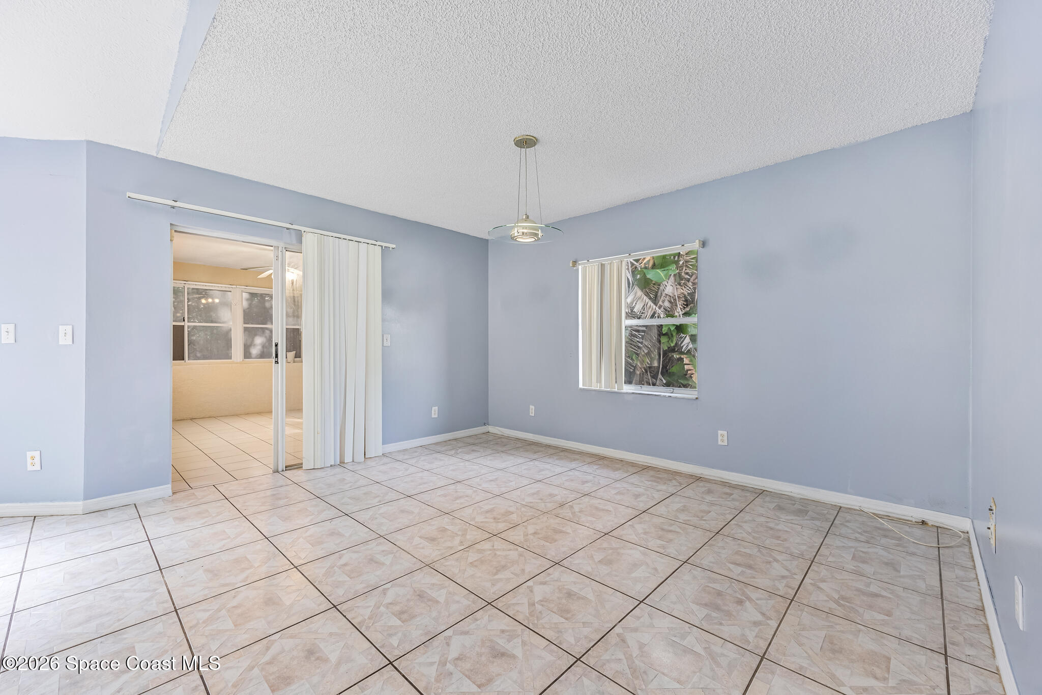 1596 Holbrook Road Northwest Palm Bay, FL 32907 - Photo 10 of 20 Dining Room to Florida Room