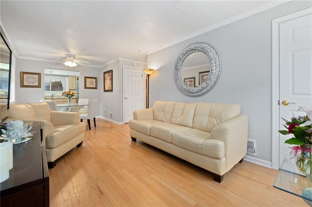 1532 Rutherford Avenue Pittsburgh, PA 15216 - Photo 3 of 36 As You Enter The Home You Are Greeted By The Light And Bright Living Room Featuring Hardwood Floors
