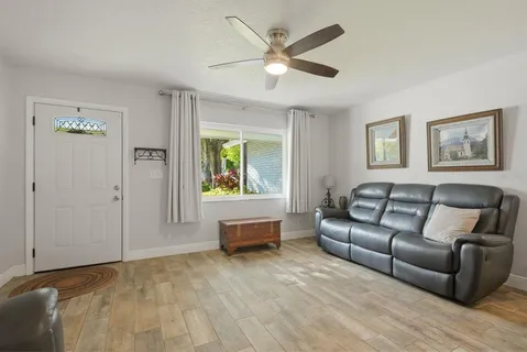 a living room with furniture and a window