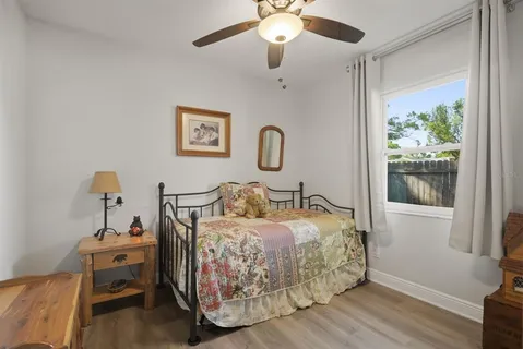 a bedroom with bed and a window