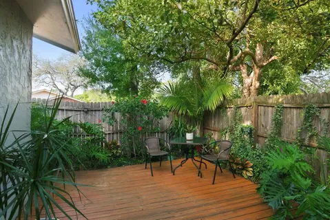 a view of a pathway both side of house