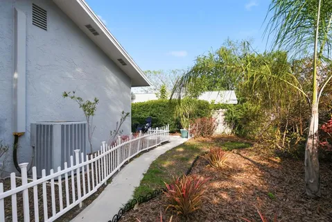 an aerial view of a house with a yard and garden