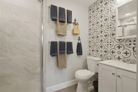 a bathroom with a toilet and shower