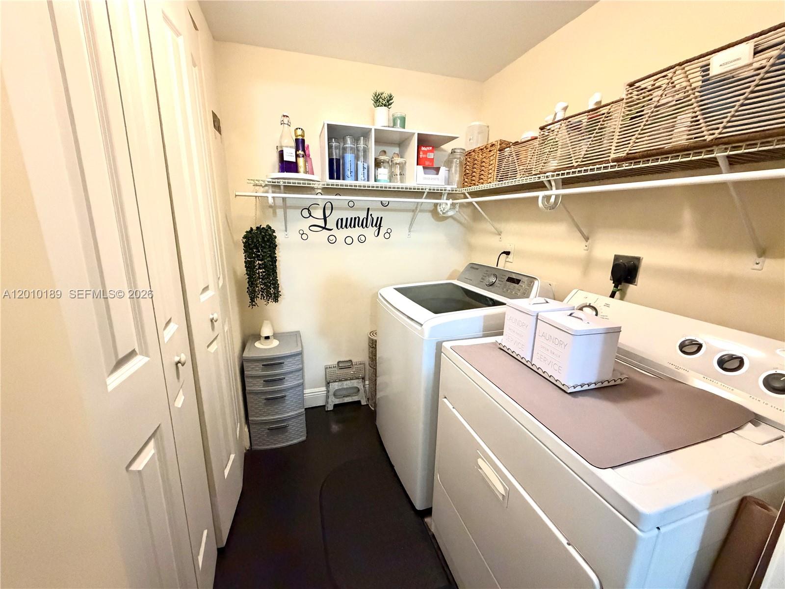 2641 North Flamingo Road, Unit TH4N Sunrise, FL 33323 - Photo 21 of 30 a utility room with dryer and washer