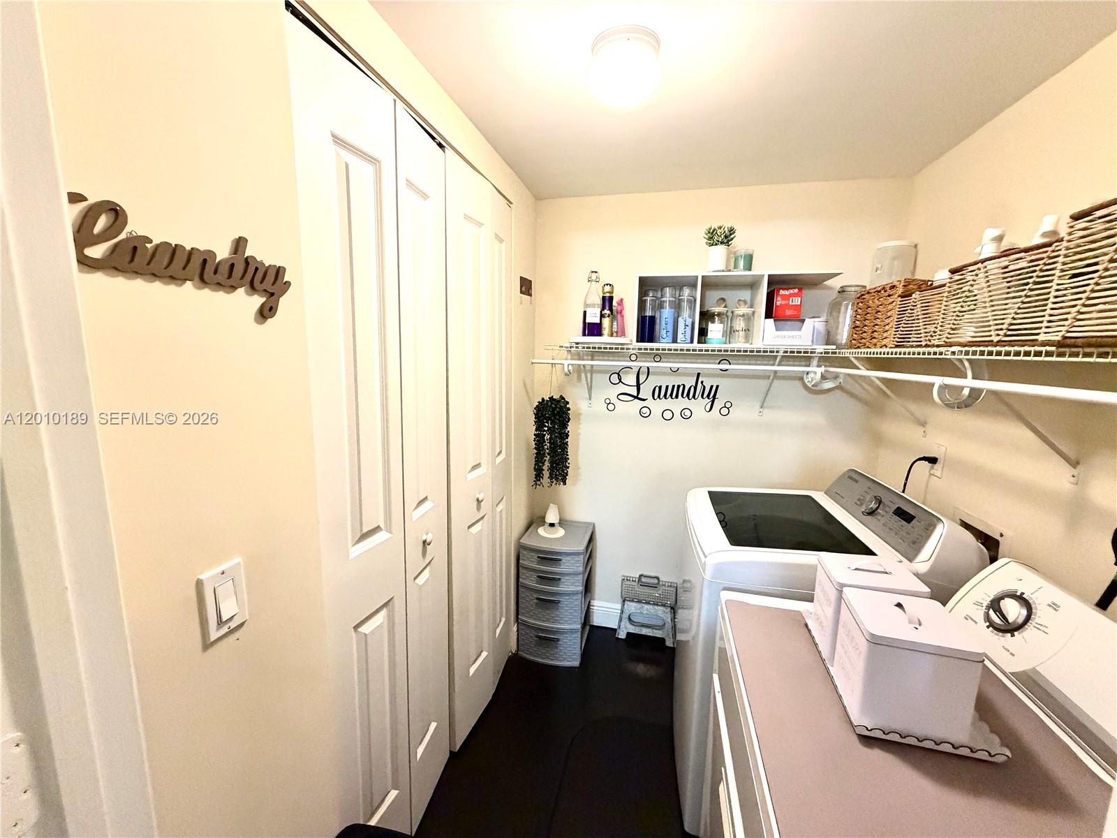 2641 North Flamingo Road, Unit TH4N Sunrise, FL 33323 - Photo 22 of 30 a living room with a couch and a table with wooden floor