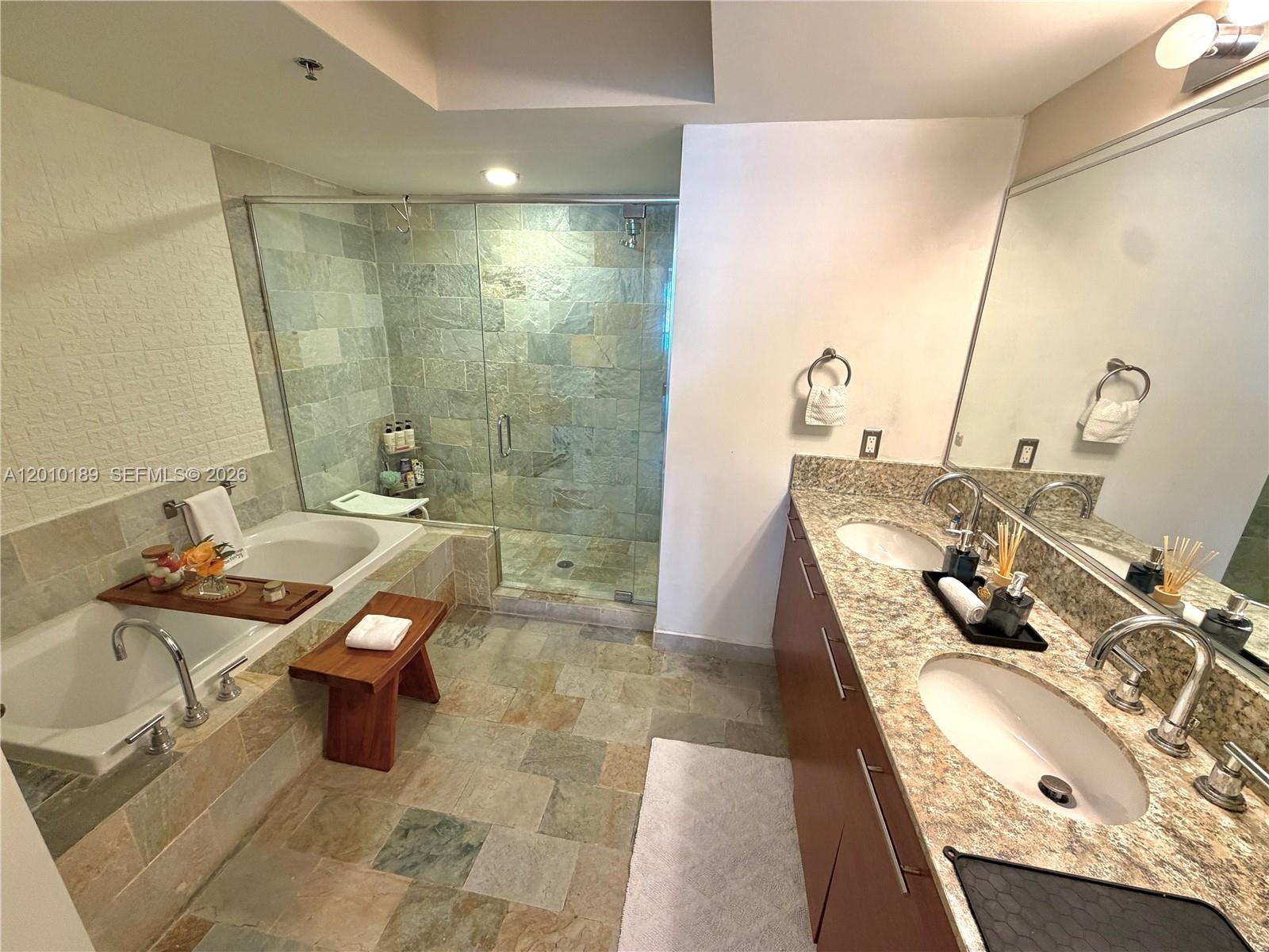 2641 North Flamingo Road, Unit TH4N Sunrise, FL 33323 - Photo 27 of 30 a bathroom with a sink a toilet and shower