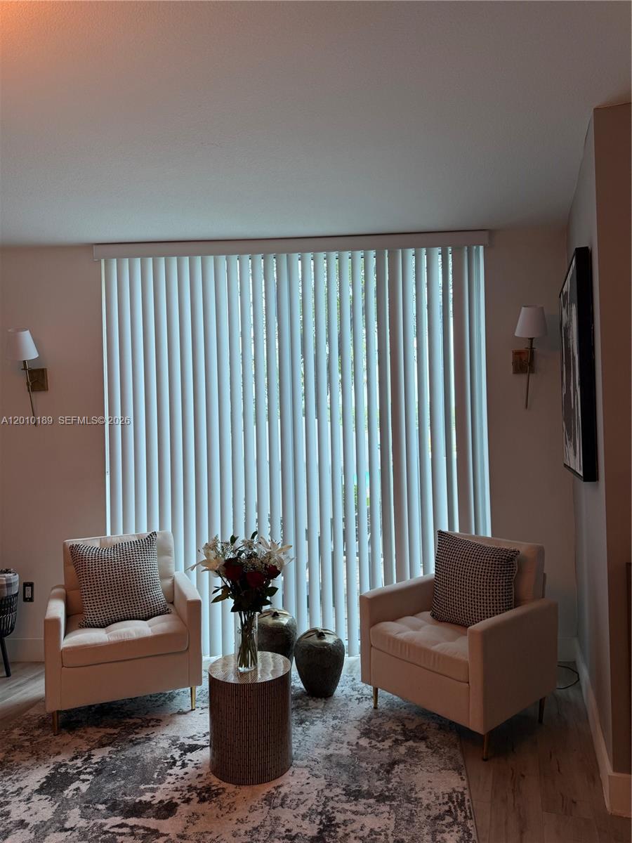 2641 North Flamingo Road, Unit TH4N Sunrise, FL 33323 - Photo 30 of 30 a living room with furniture and a potted plant