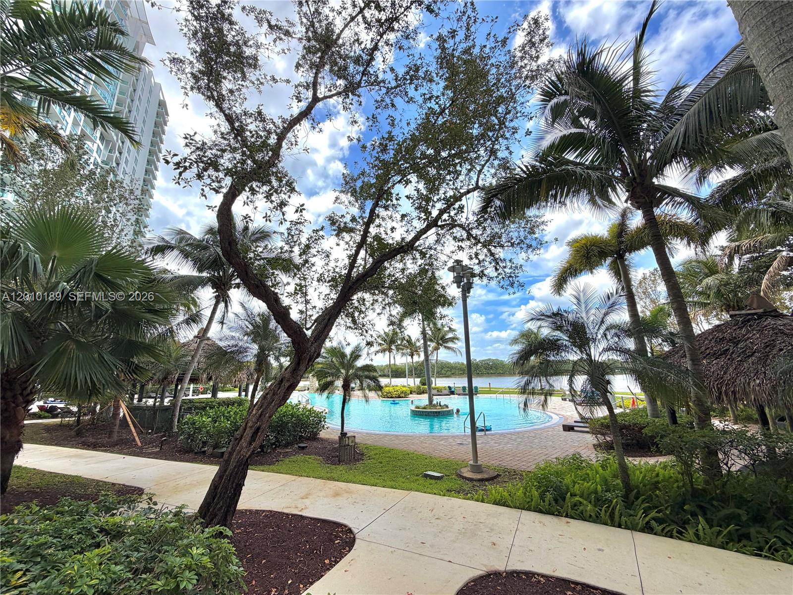 2641 North Flamingo Road, Unit TH4N Sunrise, FL 33323 - Photo 5 of 30 a view of a yard with plants and trees