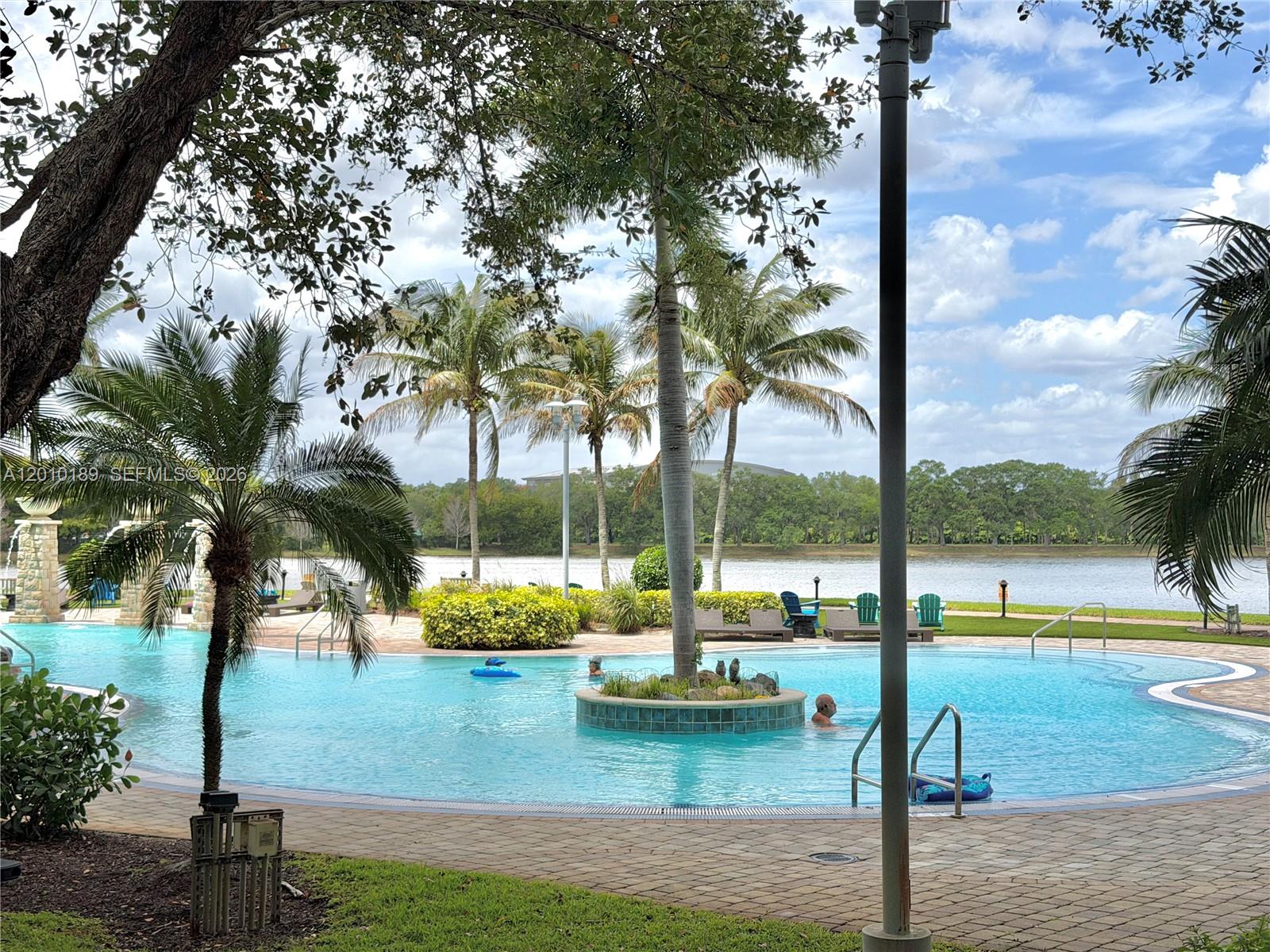 2641 North Flamingo Road, Unit TH4N Sunrise, FL 33323 - Photo 6 of 30 a view of swimming pool with outdoor seating
