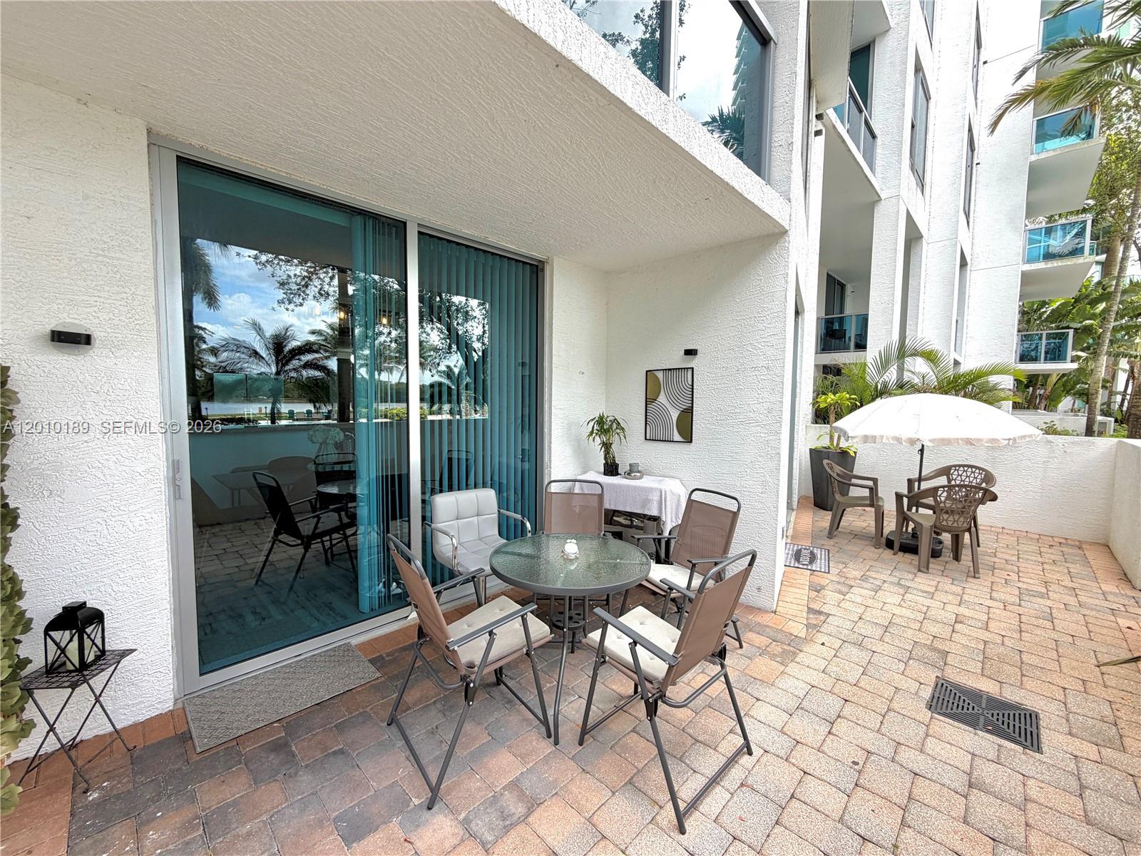 2641 North Flamingo Road, Unit TH4N Sunrise, FL 33323 - Photo 7 of 30 a outdoor space with patio furniture