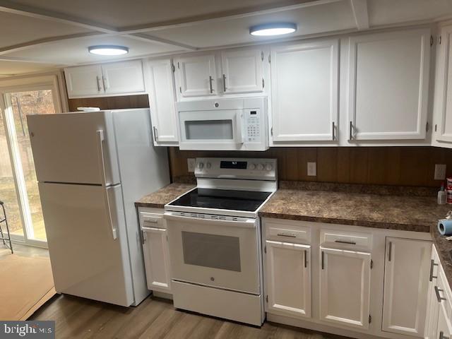 515 East Snyder Corner Road Red Lion, PA 17356 - Photo 4 of 8 a kitchen with white cabinets and white appliances