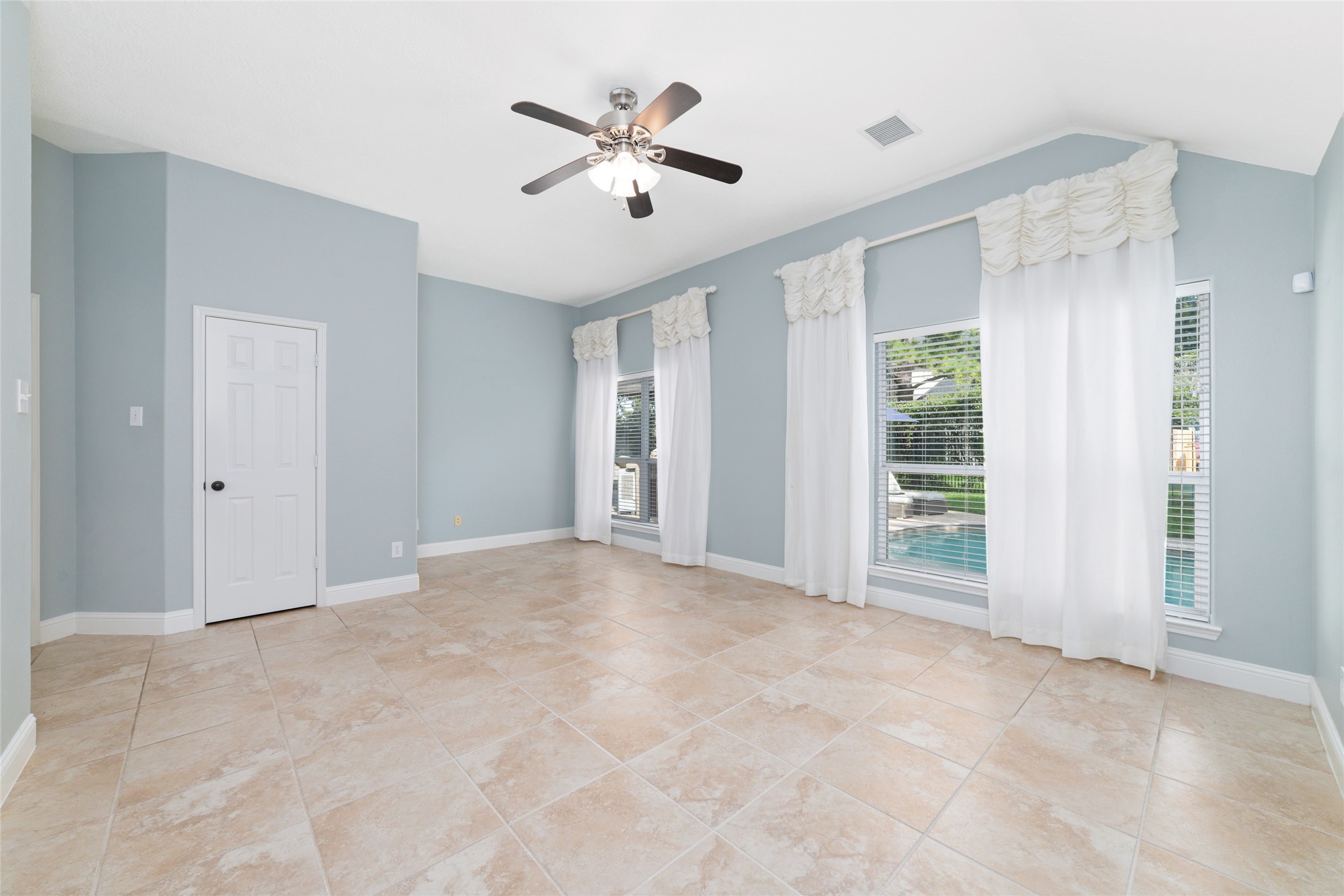 24203 Moon Ridge Court Katy, TX 77494 - Photo 24 of 43 The large primary bedroom features windows offering a view of a pool and has an extra closet!