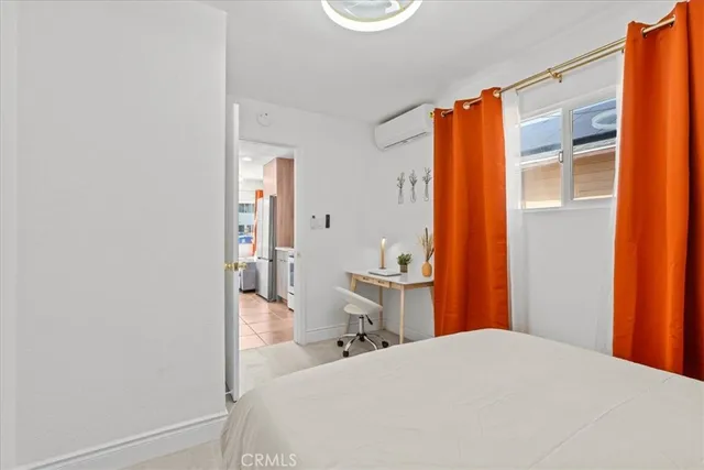 a bathroom with a sink toilet and a mirror