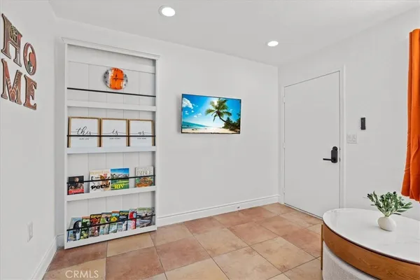 a view of an empty room with shelves