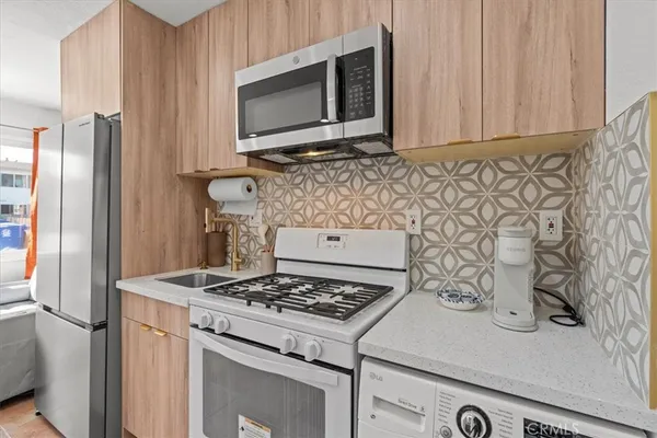 a kitchen with a stove and a microwave