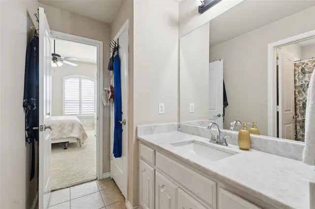 a bedroom with a bed dresser and a window