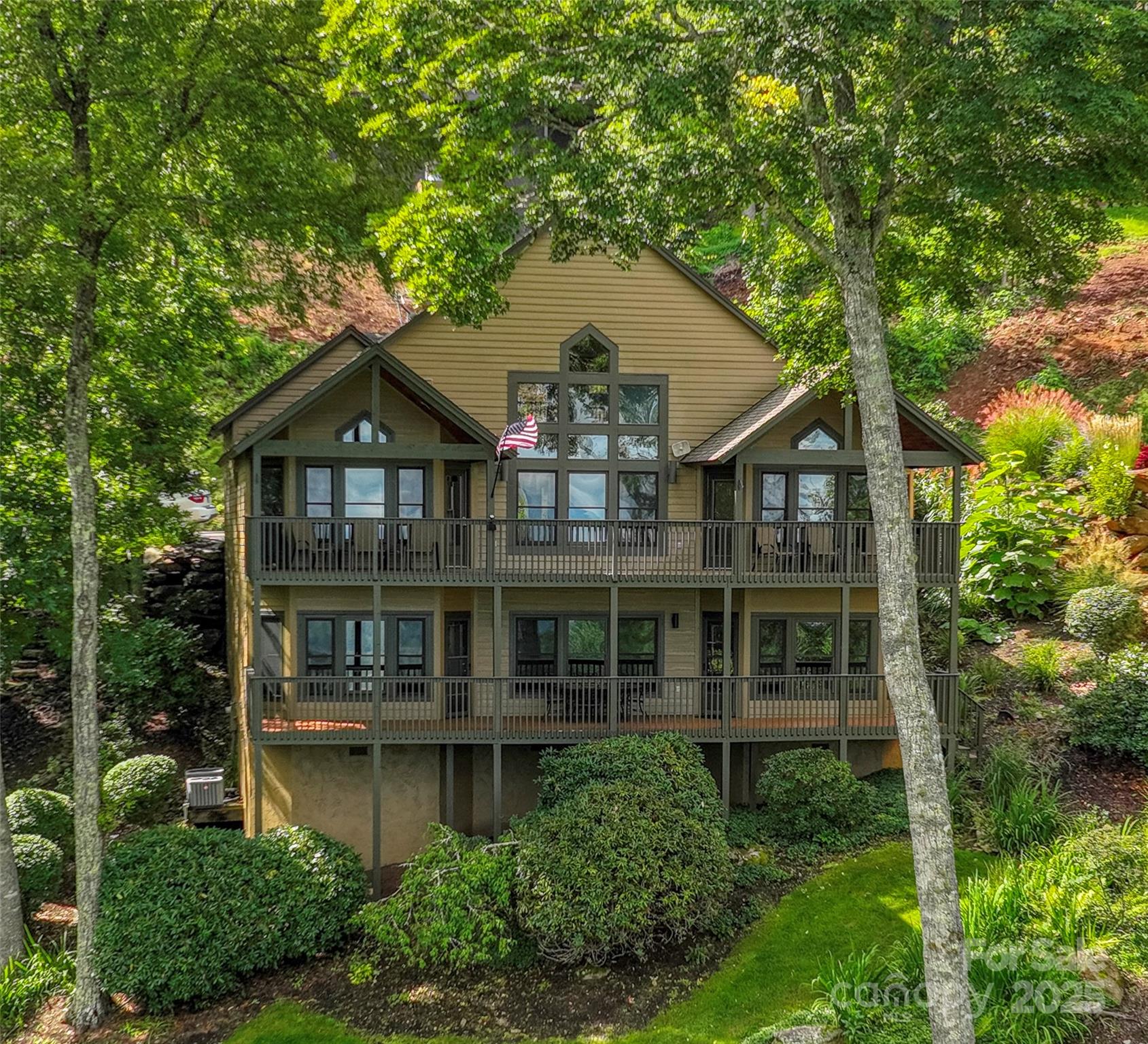 91 Brandy Run Road Burnsville, NC 28714 - Photo 1 of 48 a front view of a house with a yard and trees