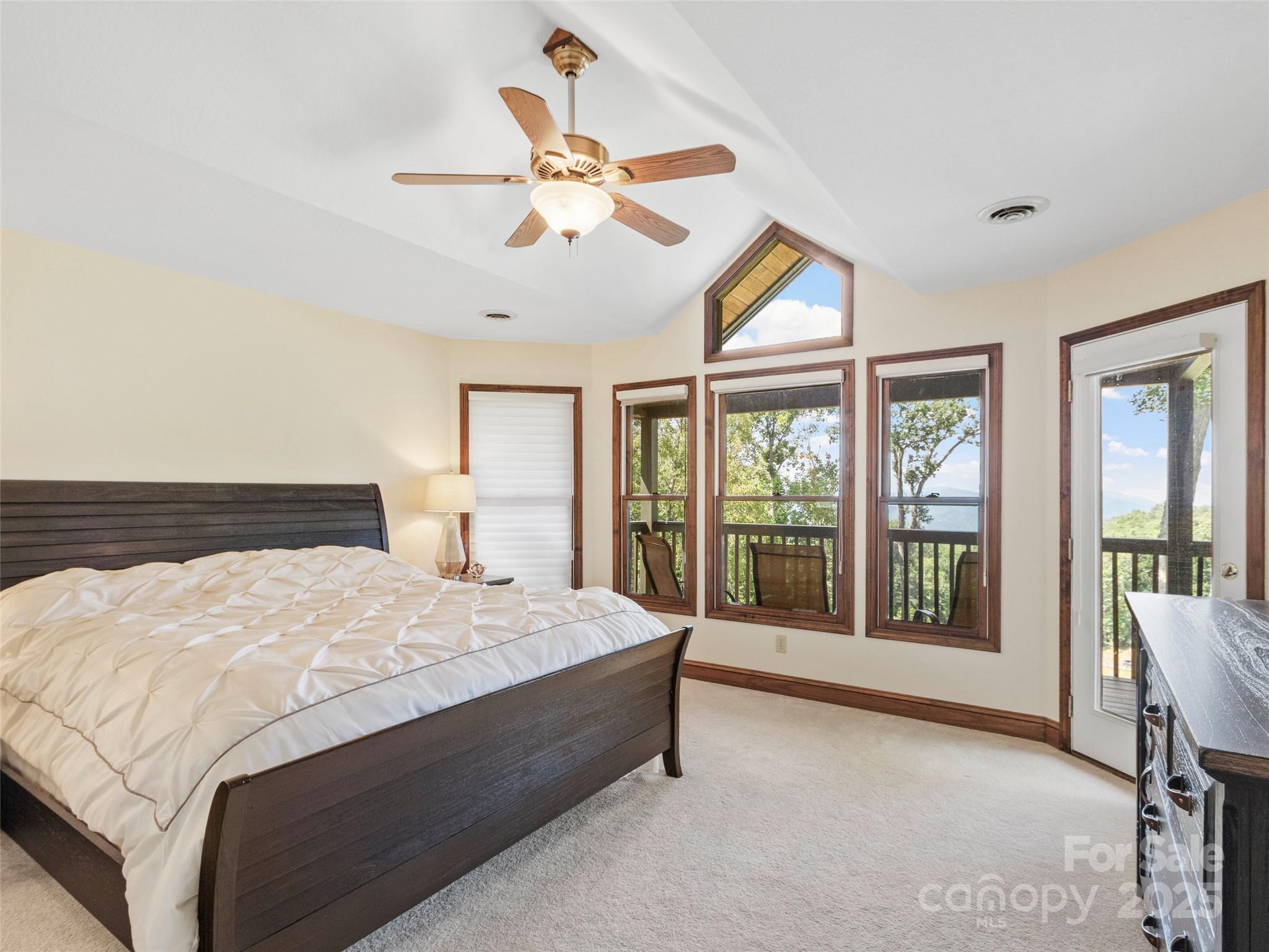 91 Brandy Run Road Burnsville, NC 28714 - Photo 20 of 48 a bed sitting in a bedroom next to a window