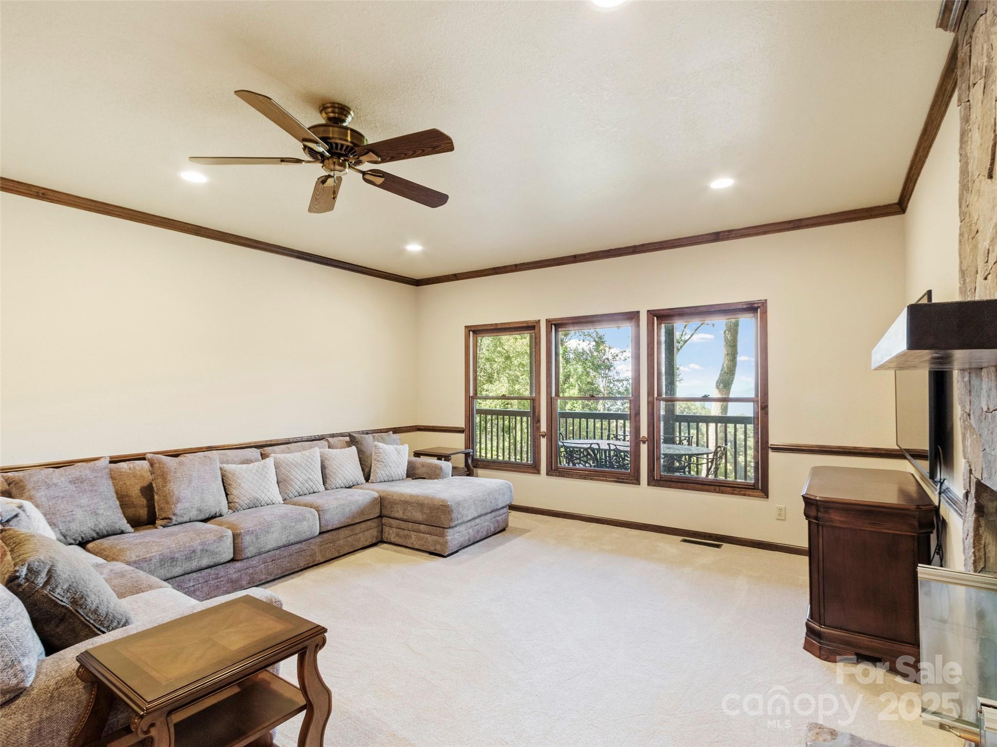 91 Brandy Run Road Burnsville, NC 28714 - Photo 27 of 48 a living room with furniture and a flat screen tv