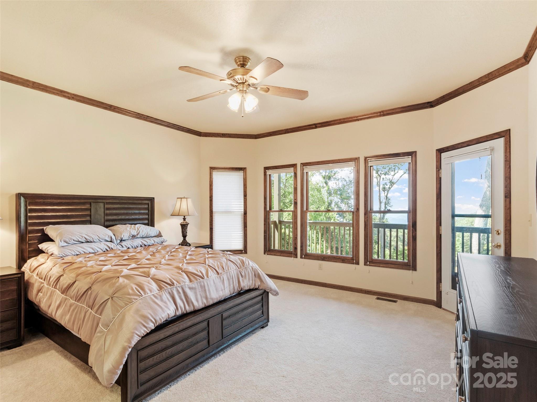91 Brandy Run Road Burnsville, NC 28714 - Photo 30 of 48 a bedroom with a large bed and a large window