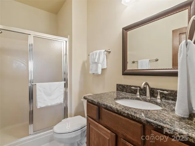 a view of a patio with a table chairs and backyard
