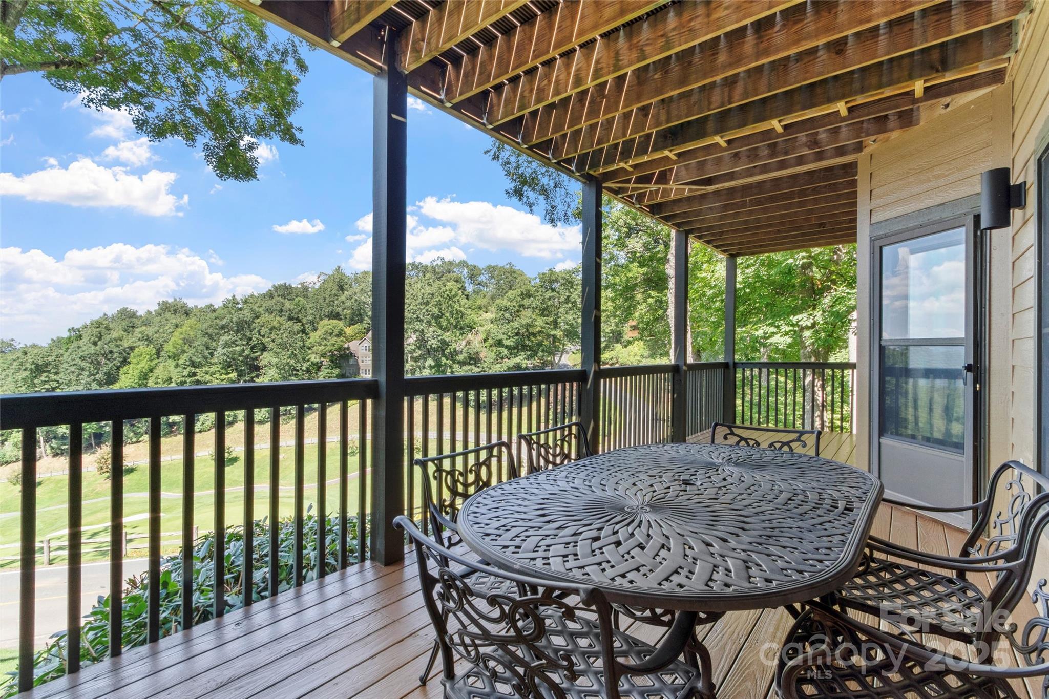 91 Brandy Run Road Burnsville, NC 28714 - Photo 36 of 48 a view of a patio with a table chairs and backyard