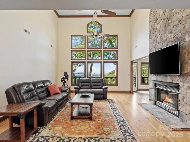 a living room with fireplace furniture and a flat screen tv