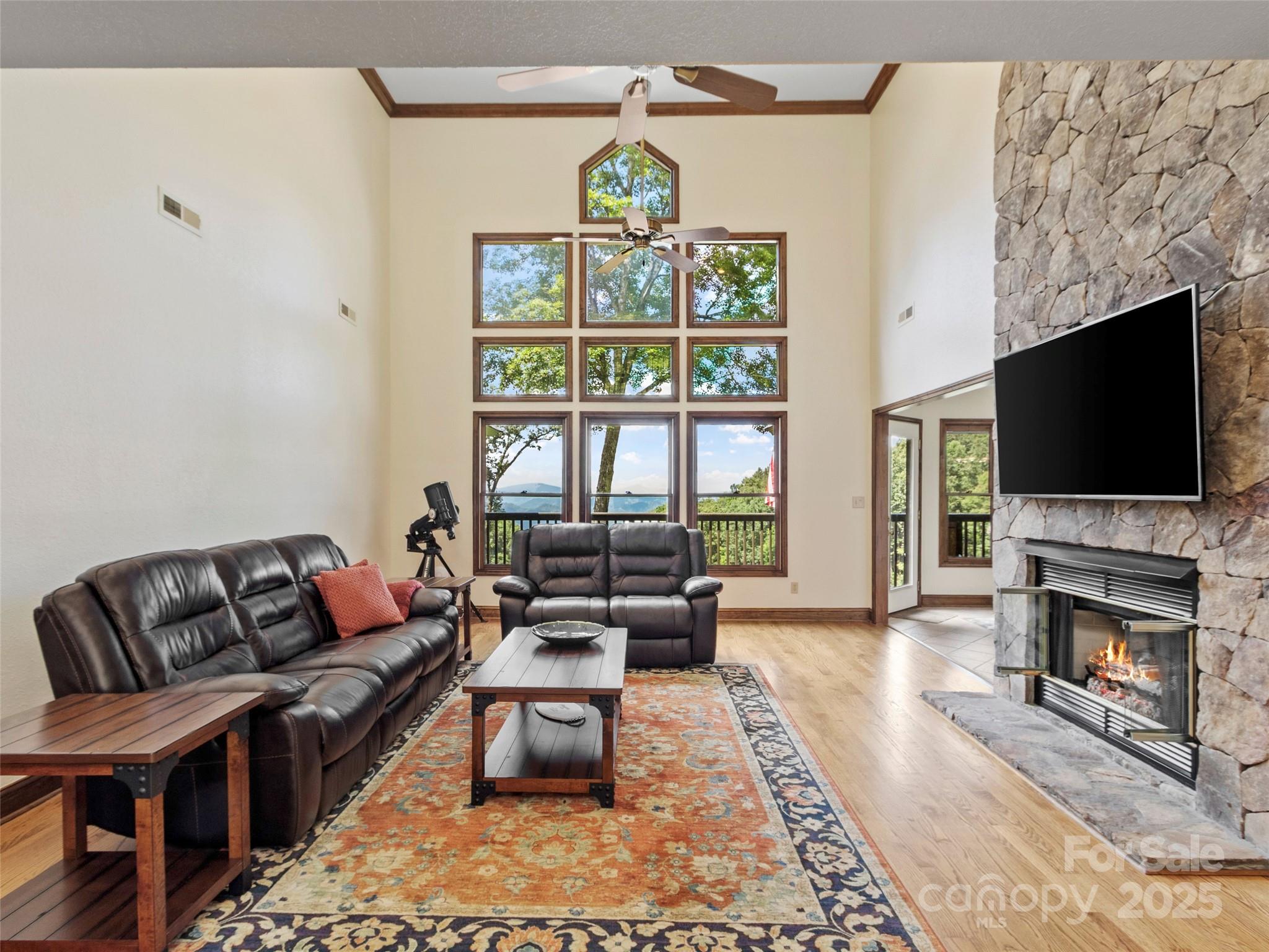 91 Brandy Run Road Burnsville, NC 28714 - Photo 4 of 48 a living room with fireplace furniture and a flat screen tv