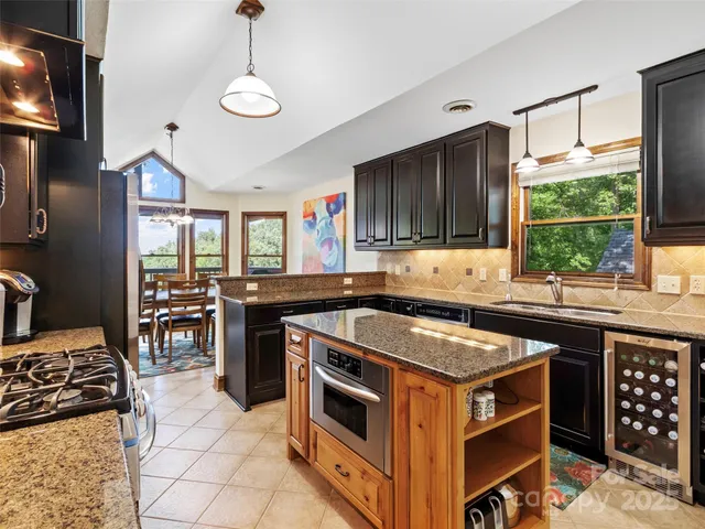 a kitchen with a stove a sink and a refrigerator