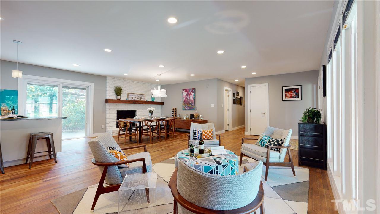 1112 Imperial Road Cary, NC 27511 - Photo 4 of 26 Enjoy the fireplace while cooking or drinking a glass of wine with family or friends! The hardwood floors are fabulous!