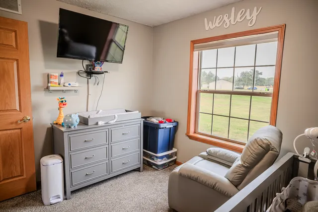a room with furniture and flat screen tv
