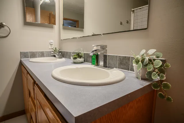 a bathroom with a sink and a mirror