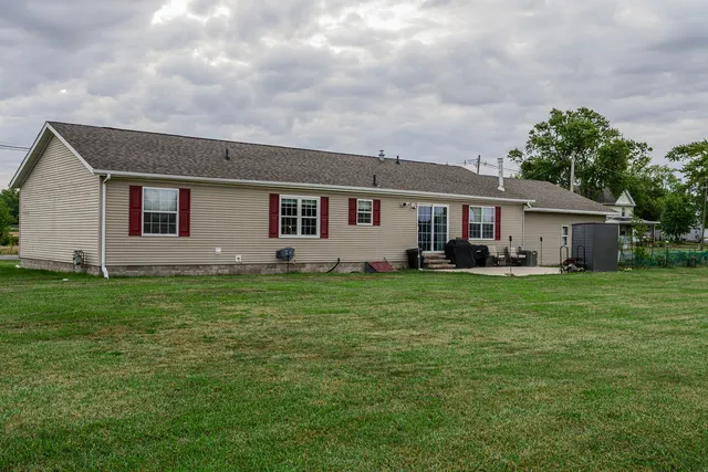 a front view of house with yard and green space