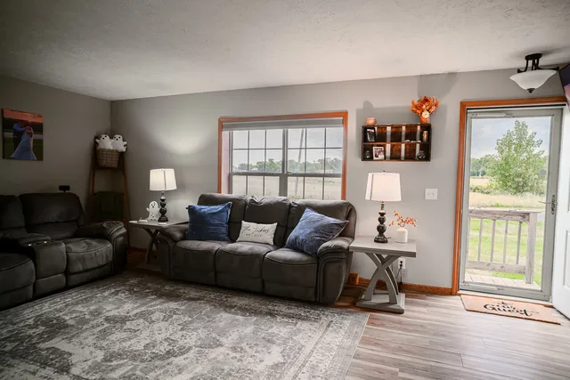 a living room with furniture and a window