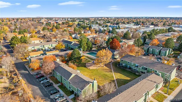 a view of a house with swimming pool and sitting area