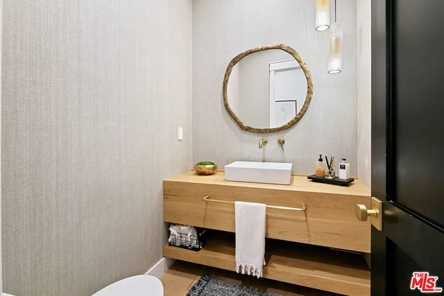 a bathroom with a sink and a mirror